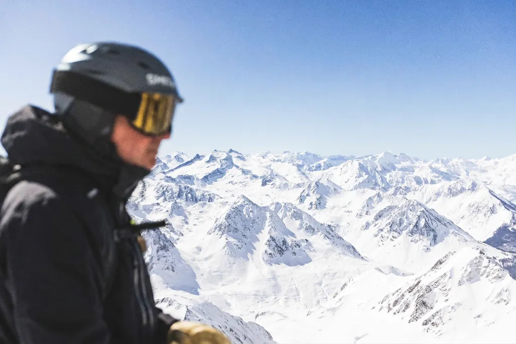 Olivier looking over snow-covered mountains